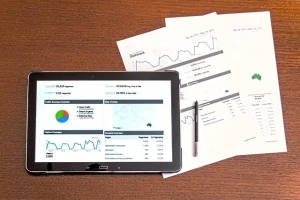 Tablet and paper on desk